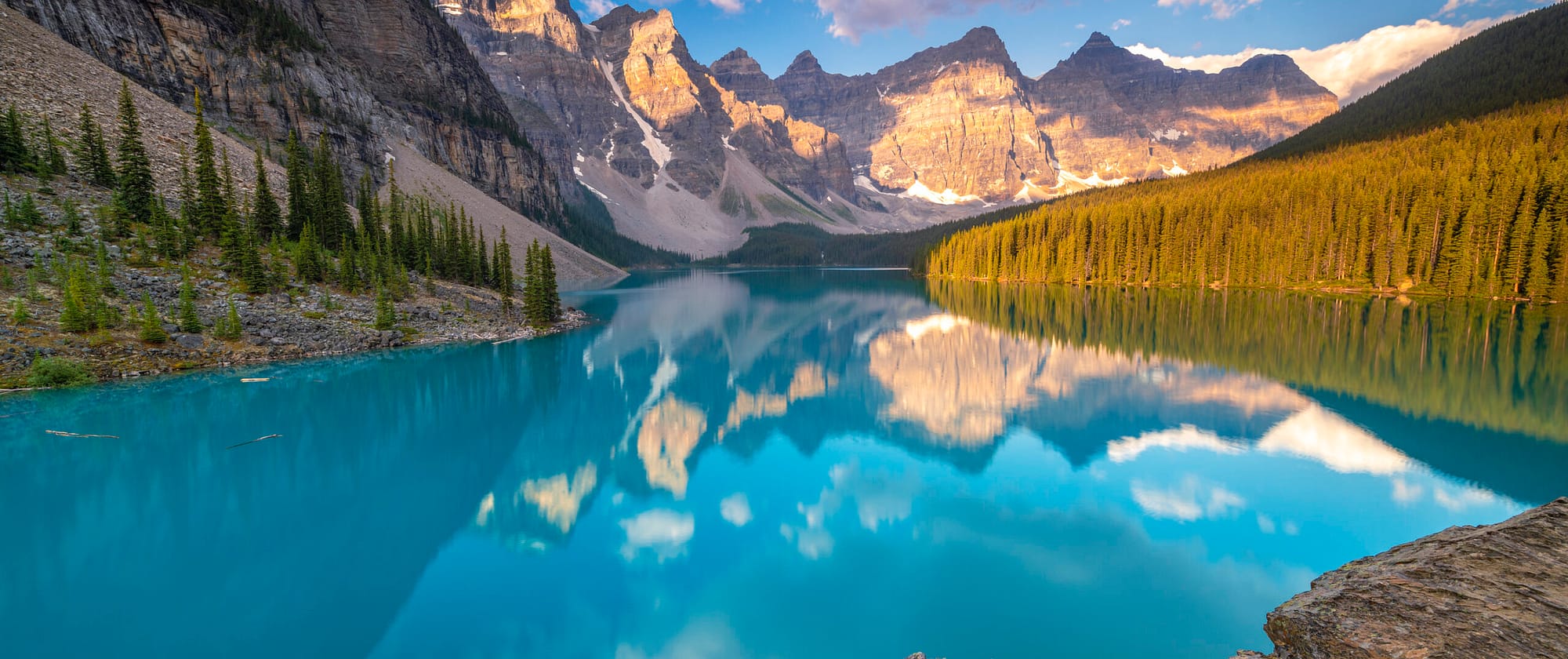 a canyon with Moraine Lake in the background