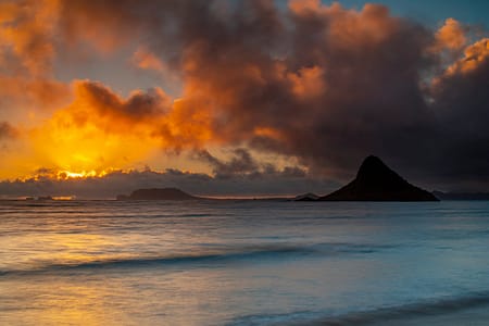 sunrise over Hawaiian islands in the ocean