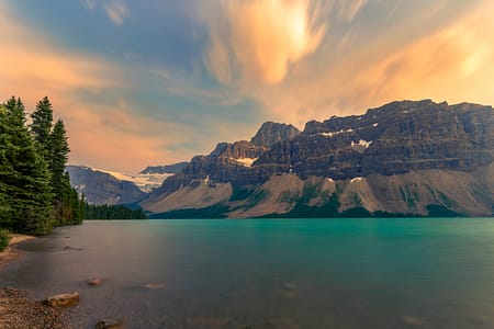 a body of water in the Canadian Rocky mountains in the background