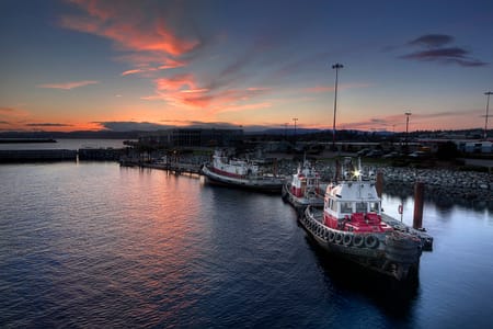 tug boats docked in the pacific northwest ocean